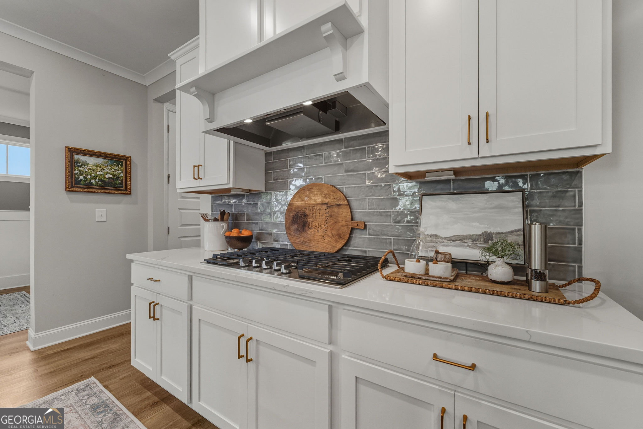 1140 Providence Loop Greensboro, GA 30642 - Photo 11 of 28 a kitchen with white cabinets and a stove