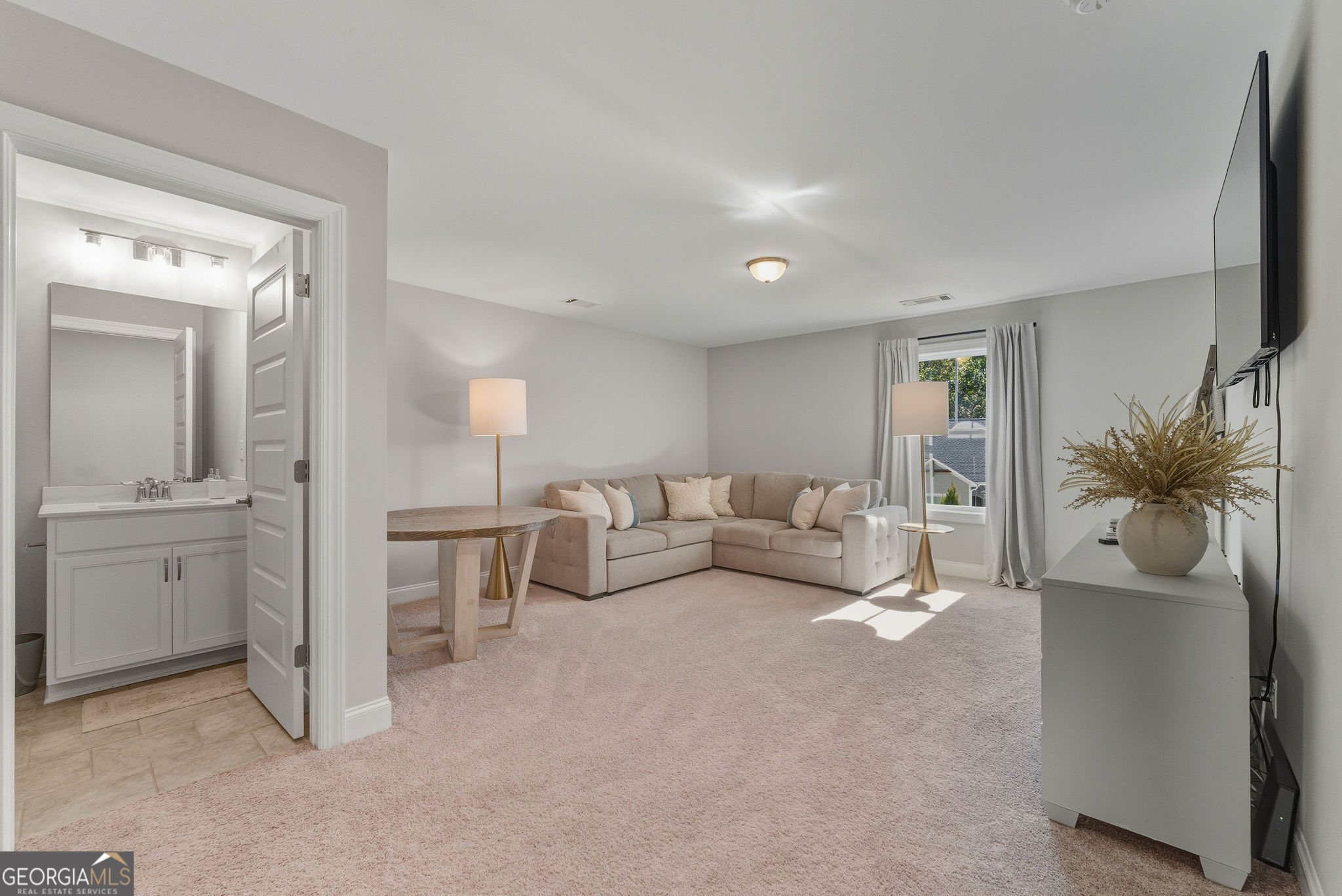 1140 Providence Loop Greensboro, GA 30642 - Photo 23 of 28 a living room with furniture and a flat screen tv