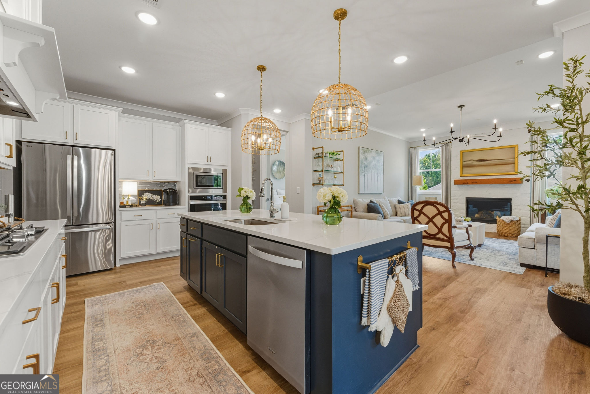 1140 Providence Loop Greensboro, GA 30642 - Photo 7 of 28 a kitchen with granite countertop a stove a sink a oven and a refrigerator