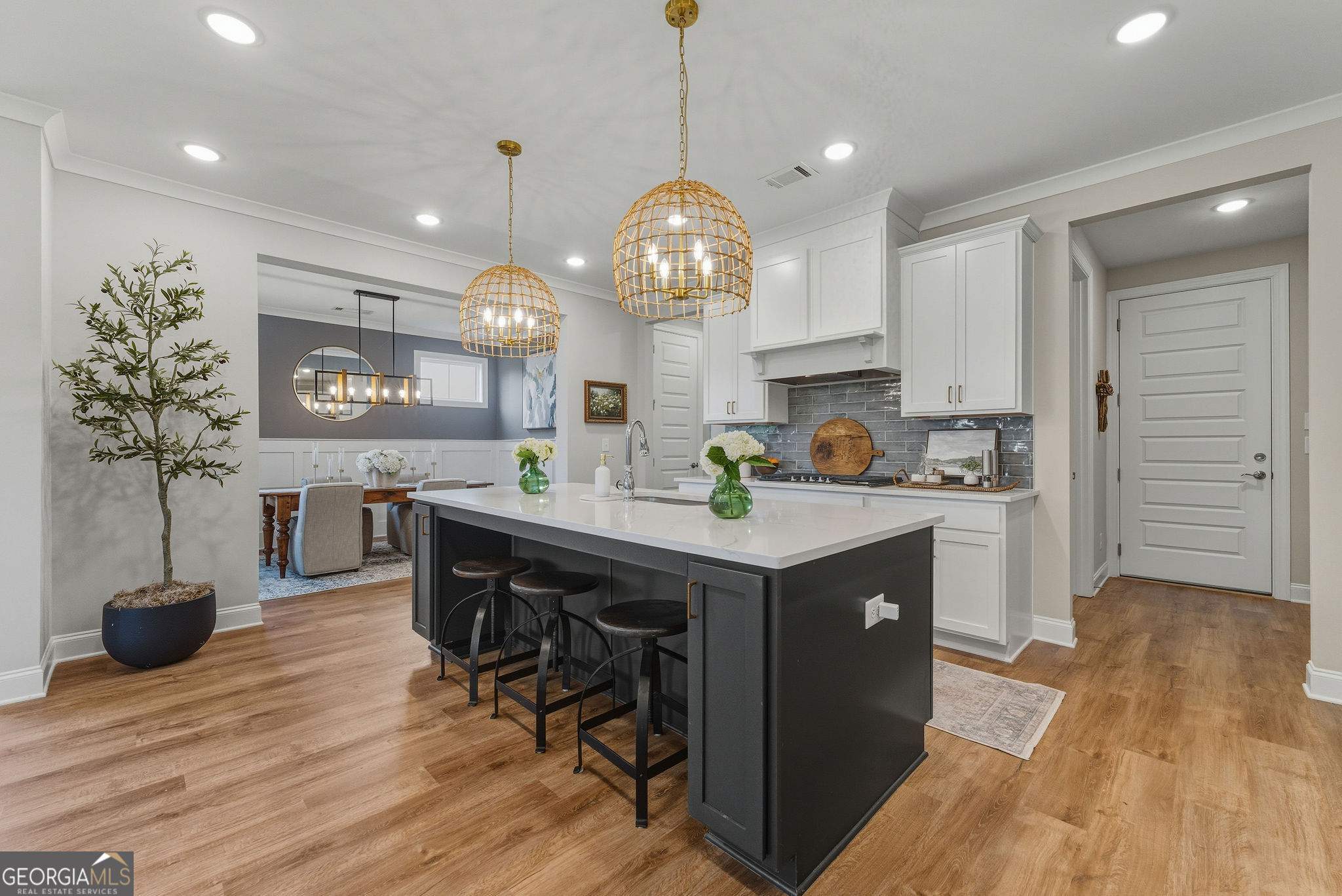 1140 Providence Loop Greensboro, GA 30642 - Photo 8 of 28 a kitchen with stainless steel appliances granite countertop a sink a stove and a wooden floors
