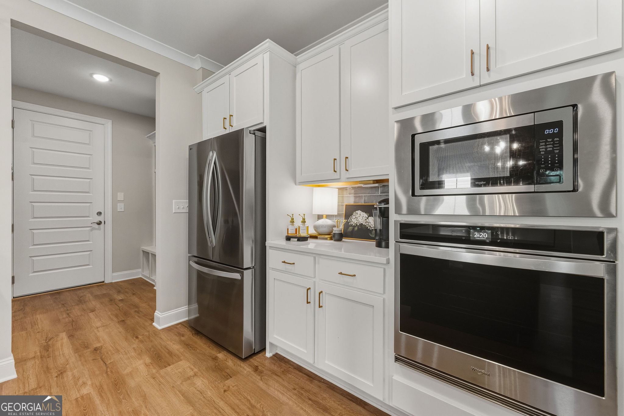 1140 Providence Loop Greensboro, GA 30642 - Photo 10 of 28 a kitchen with granite countertop stainless steel appliances and wooden cabinets