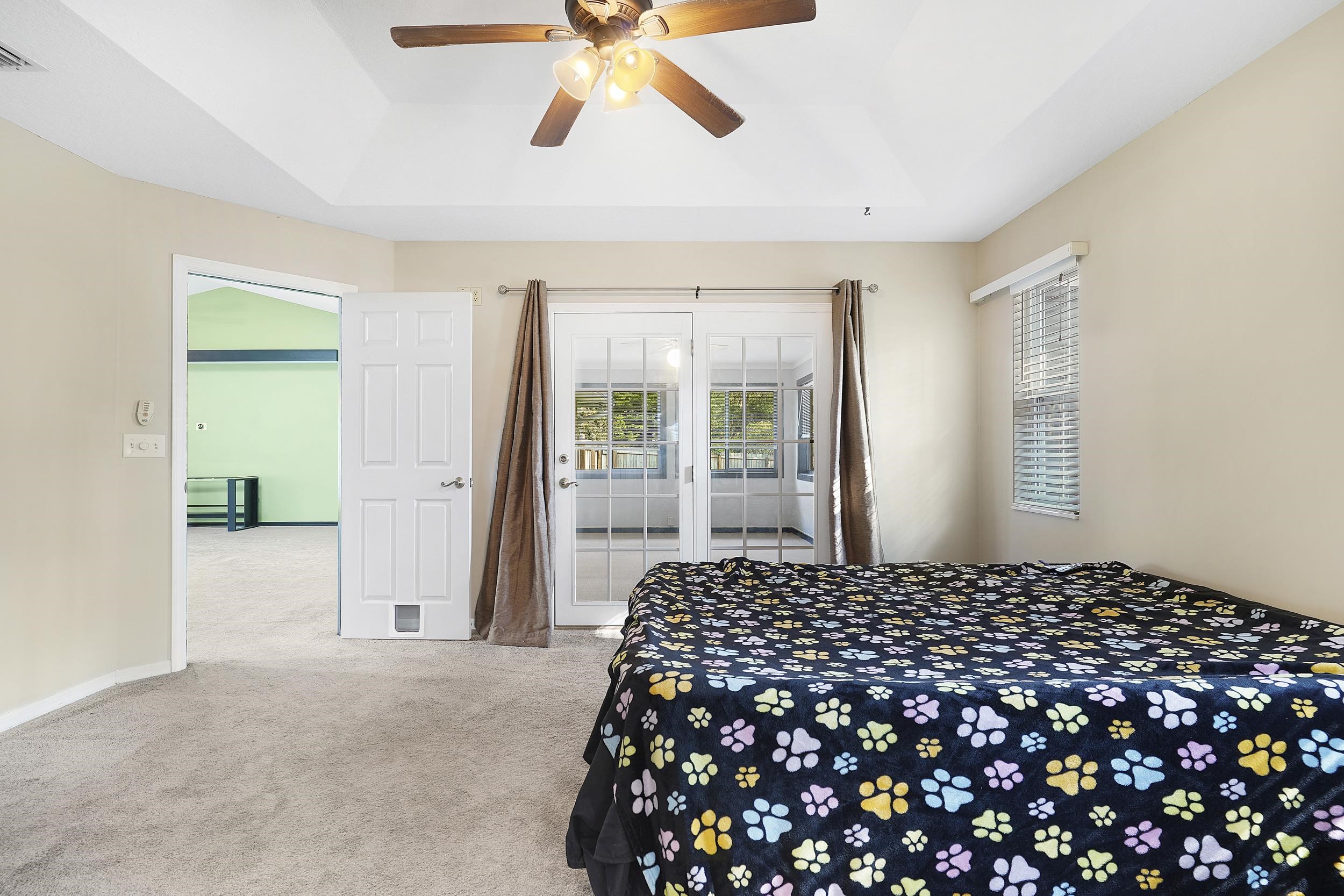 607 West Bianca Circle St. Augustine, FL 32086 - Photo 17 of 35 a bedroom with bed and window
