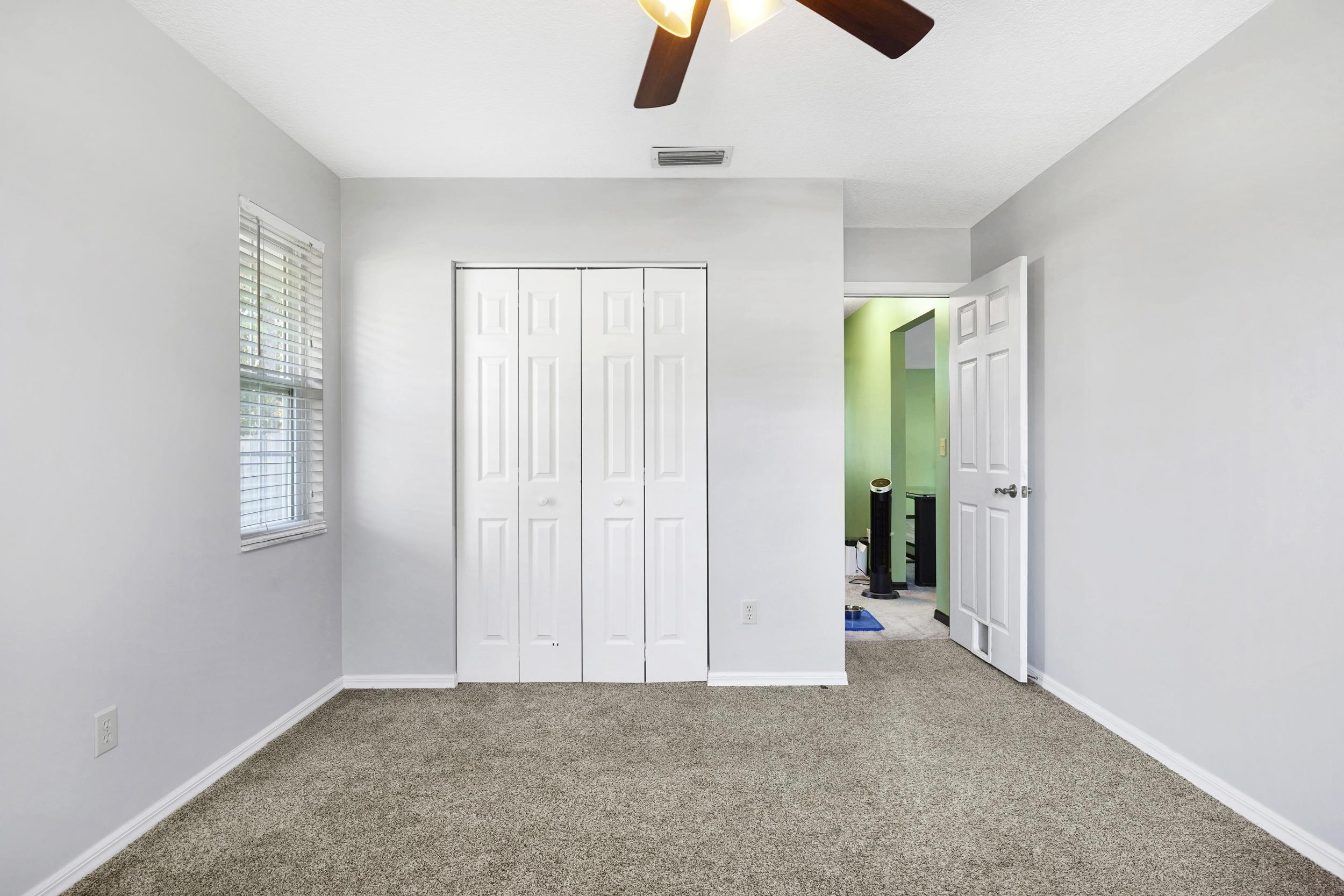 607 West Bianca Circle St. Augustine, FL 32086 - Photo 20 of 35 an empty room with windows and closet
