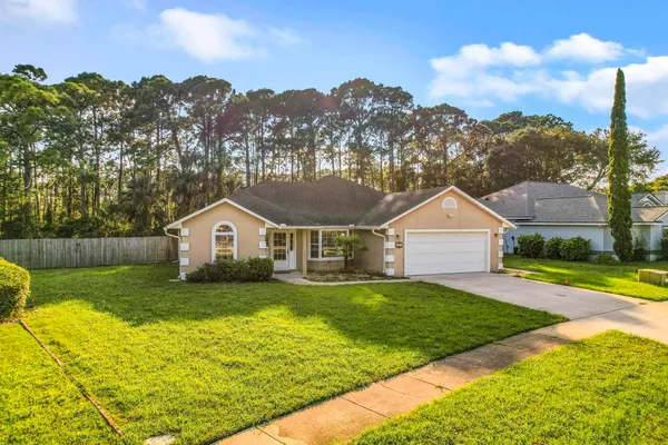 a view of a yard in front of the house with a yard