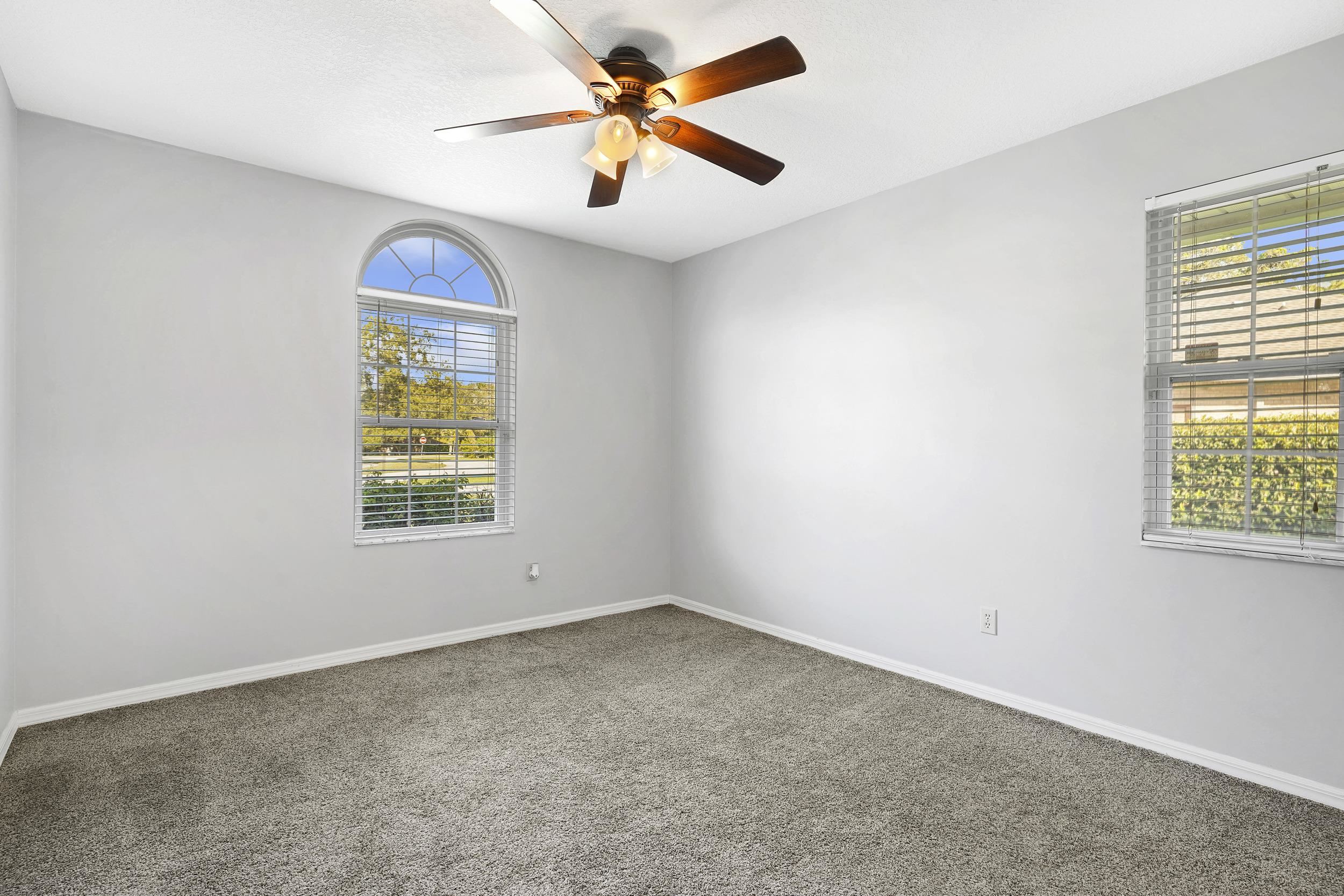 607 West Bianca Circle St. Augustine, FL 32086 - Photo 21 of 35 an empty room with windows and fan