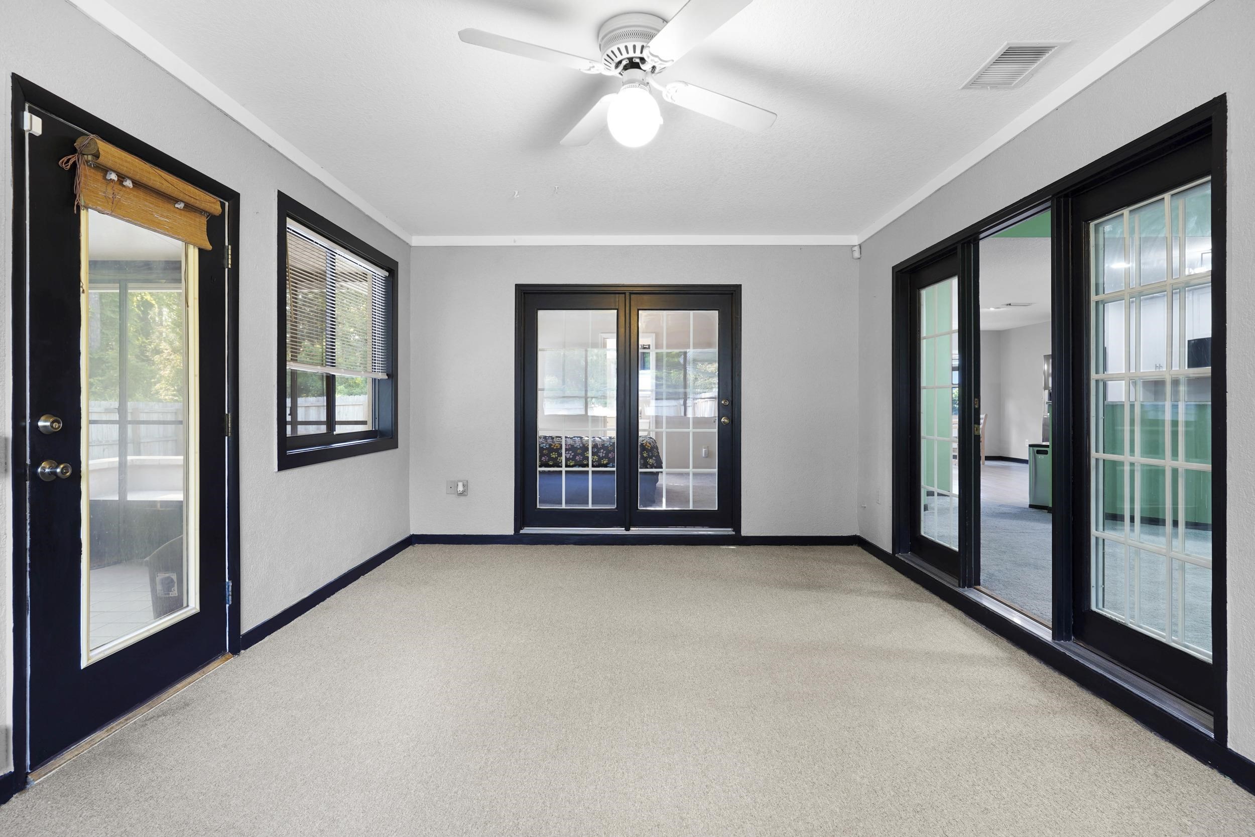 607 West Bianca Circle St. Augustine, FL 32086 - Photo 27 of 35 wooden floor in an empty room with a window