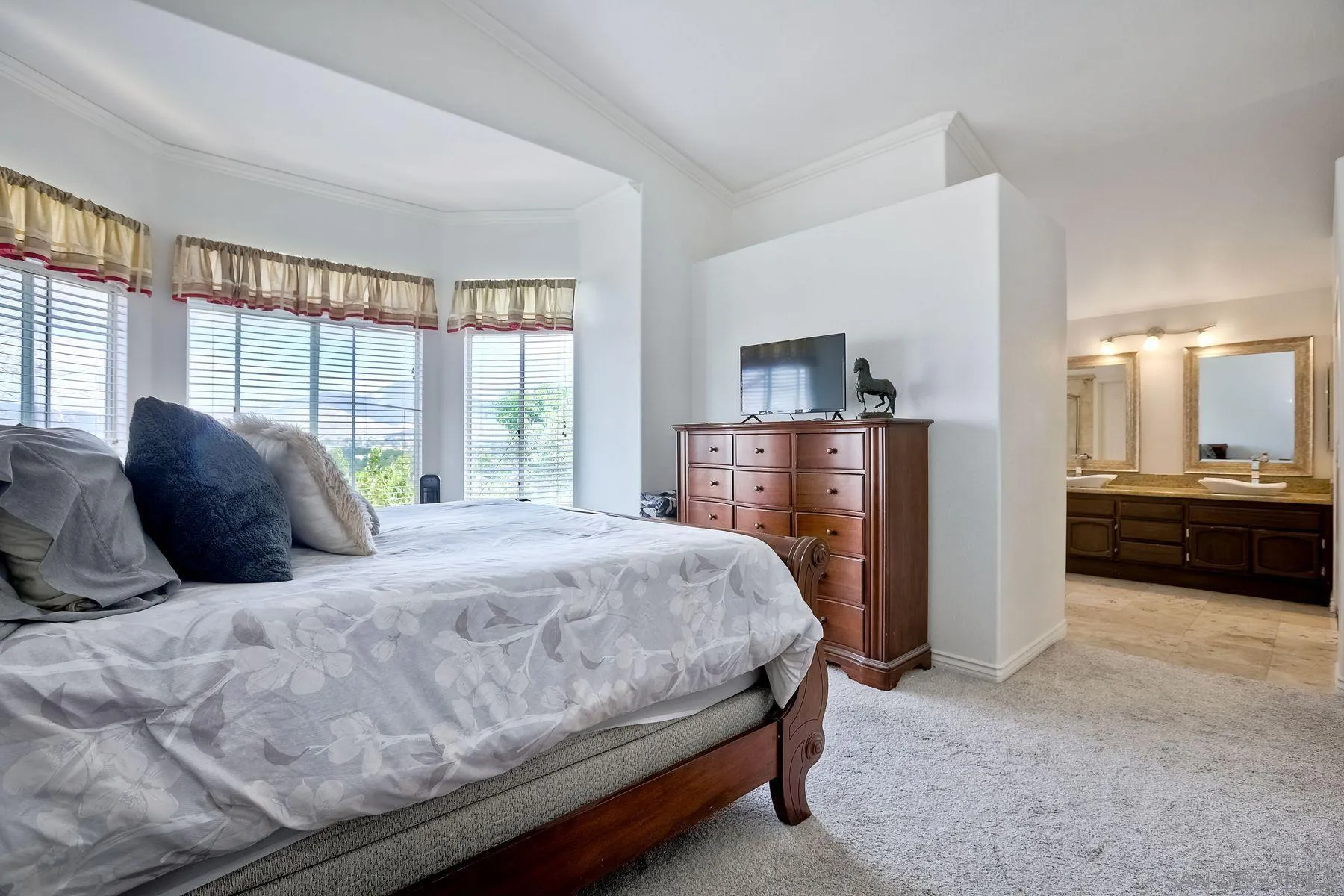 2479 Golfcrest Loop Chula Vista, CA 91915 - Photo 14 of 25 a bedroom with a bed and a large window
