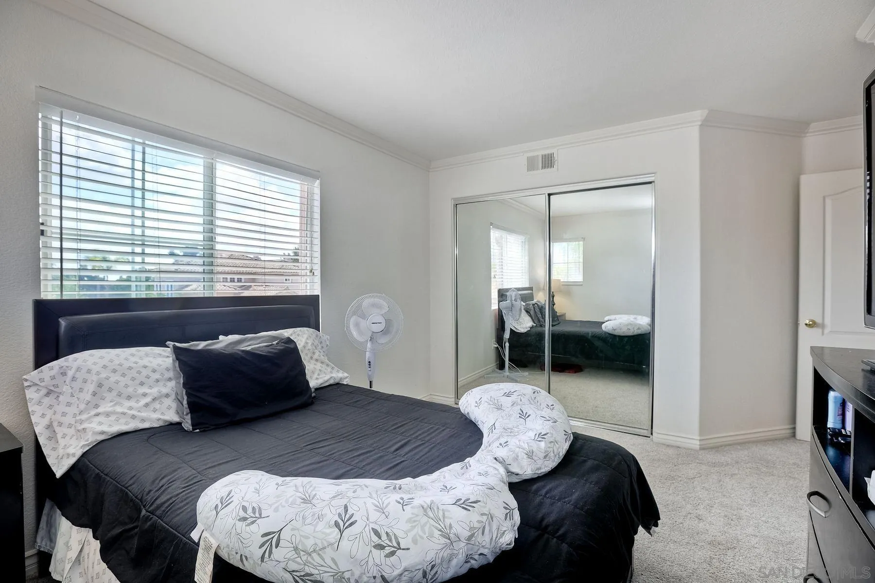 2479 Golfcrest Loop Chula Vista, CA 91915 - Photo 17 of 25 a bedroom with a bed and a mirror