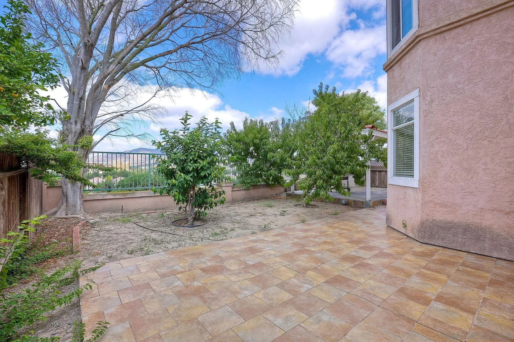 2479 Golfcrest Loop Chula Vista, CA 91915 - Photo 22 of 25 a view of a yard with a tree