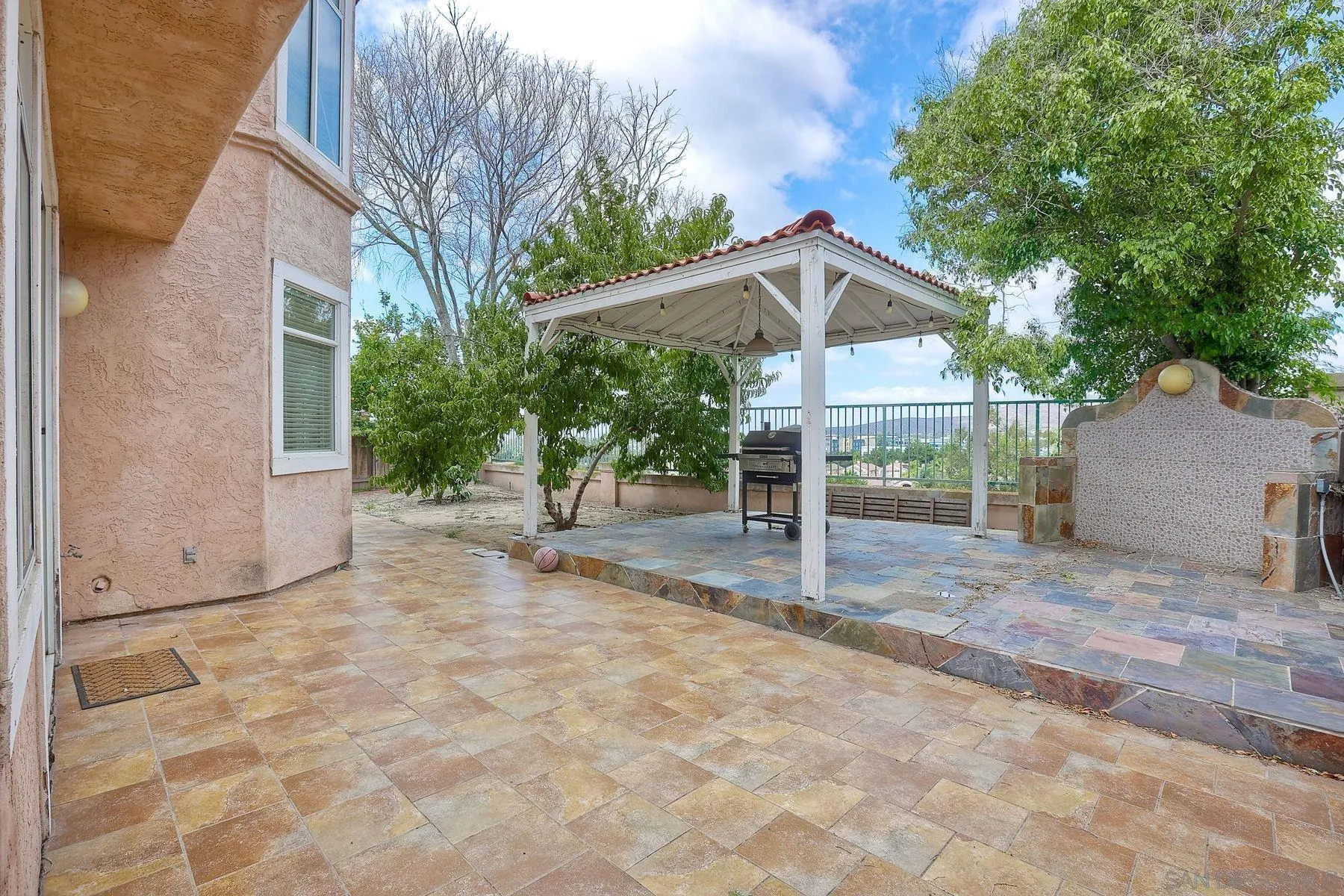 2479 Golfcrest Loop Chula Vista, CA 91915 - Photo 24 of 25 a backyard of a house with table and chairs