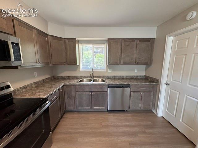 1922 Monterey Road Colorado Springs, CO 80910 - Photo 9 of 21 a kitchen with granite countertop a sink stove and cabinets