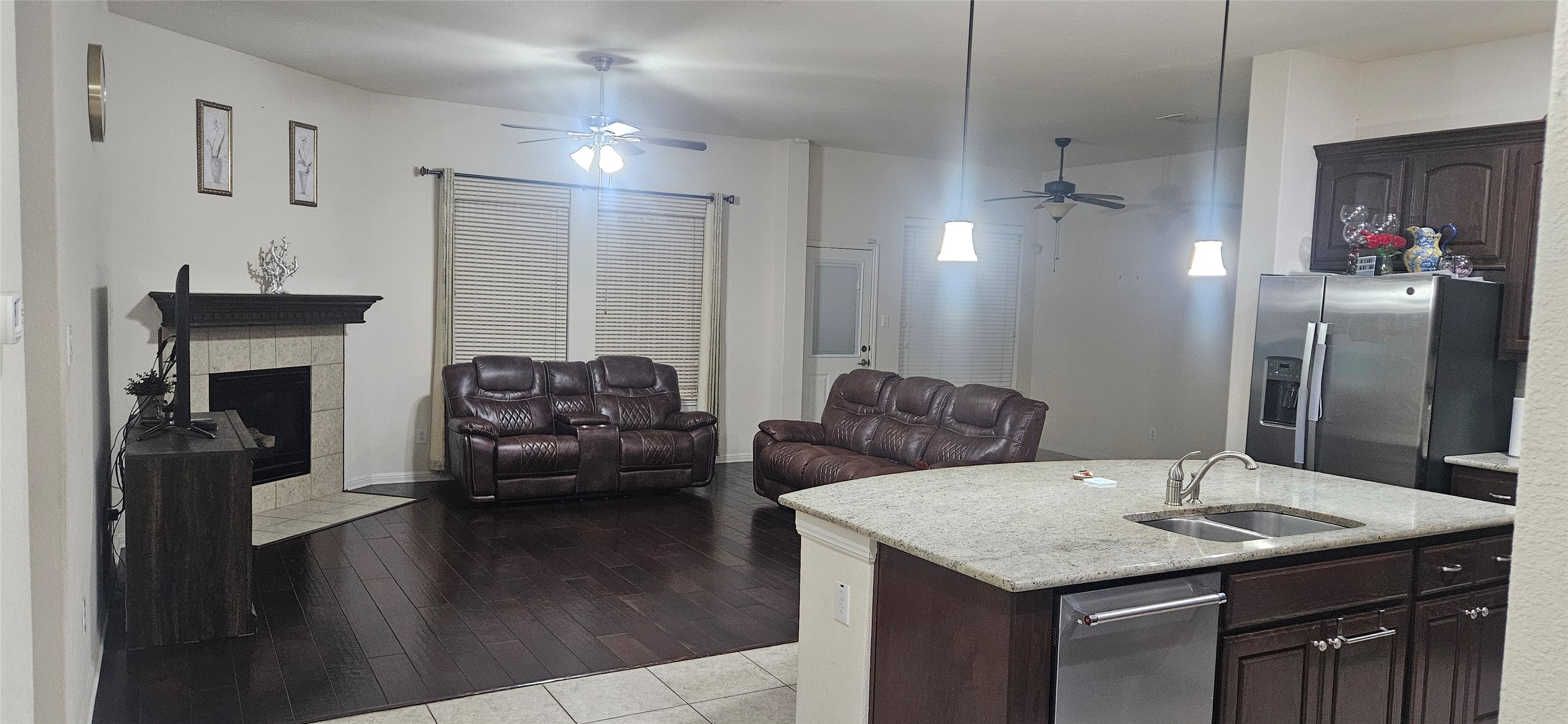 116 Azimuth Drive Austin, TX 78717 - Photo 25 of 33 a living room with stainless steel appliances kitchen island granite countertop a table chairs and a refrigerator
