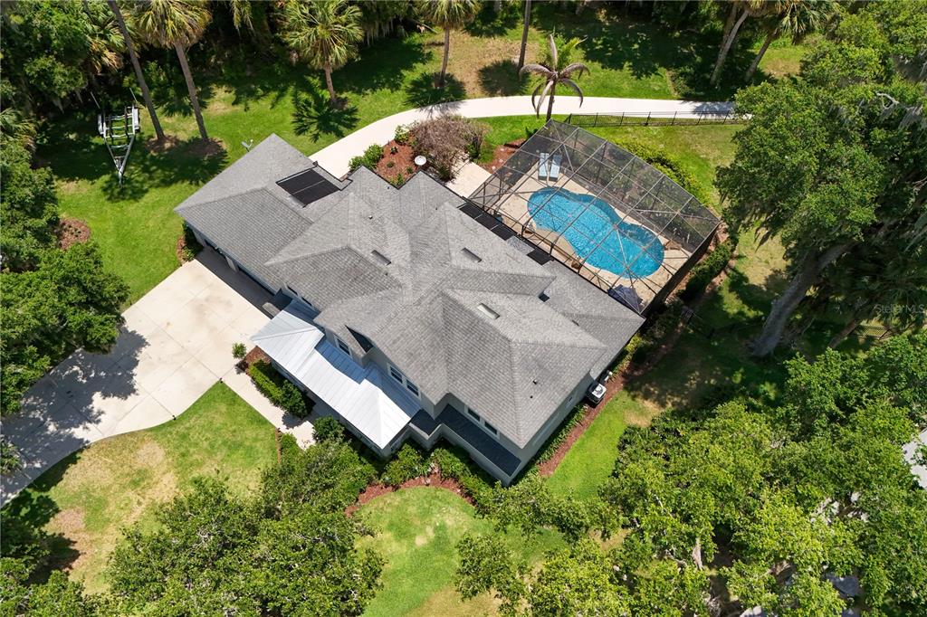 16948 Deer Island Road Tavares, FL 32778 - Photo 65 of 67 an aerial view of a house with a yard basket ball court and outdoor seating