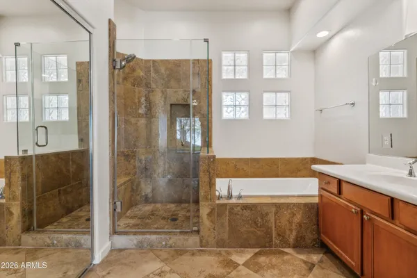 a bathroom with a shower and a sink
