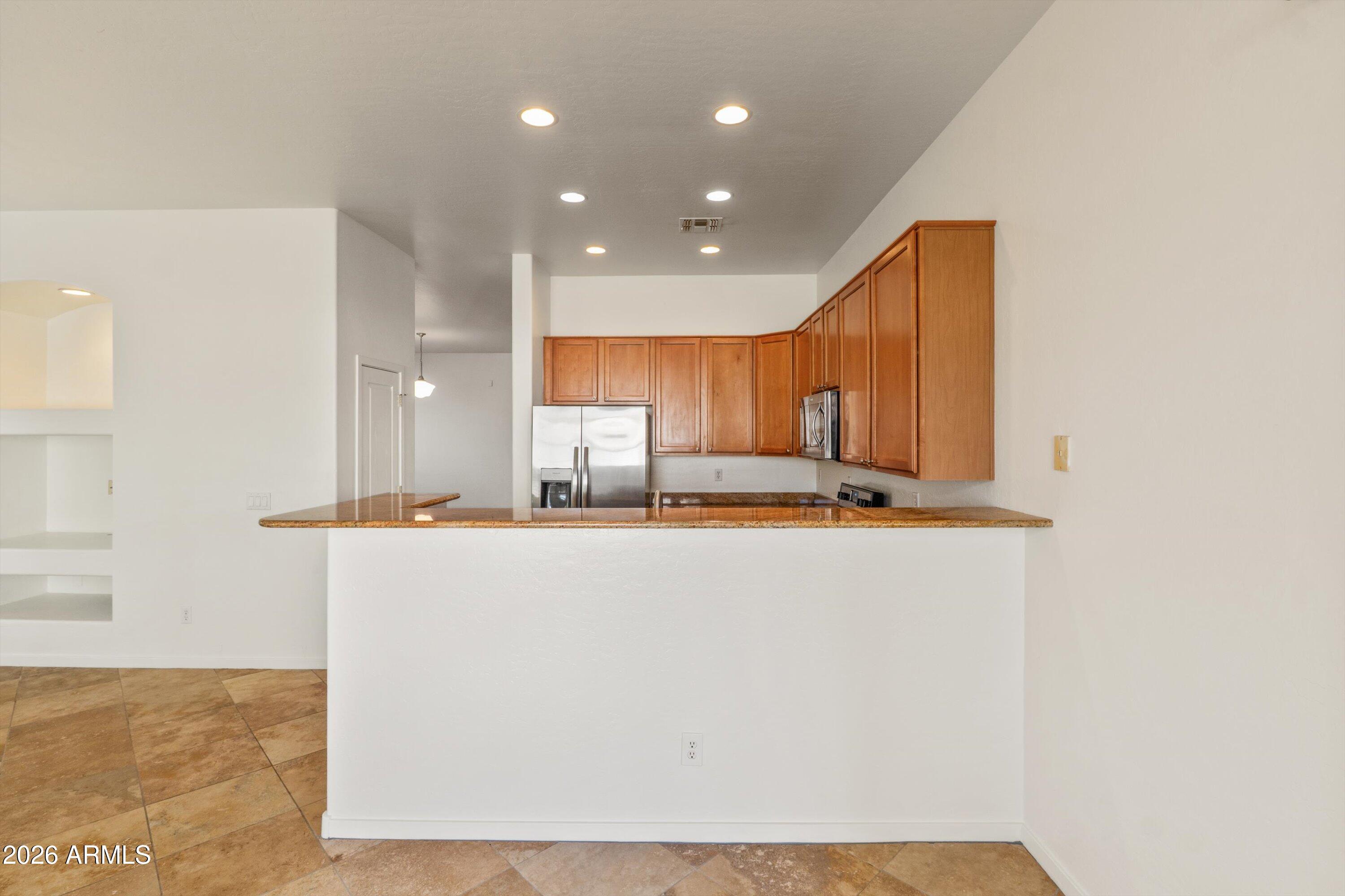 2130 East Beautiful Lane Phoenix, AZ 85042 - Photo 17 of 35 a view of kitchen with counter top space and stainless steel appliances