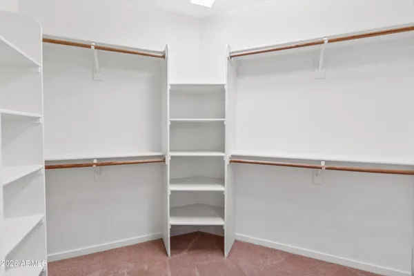 a view of an empty walk in closet