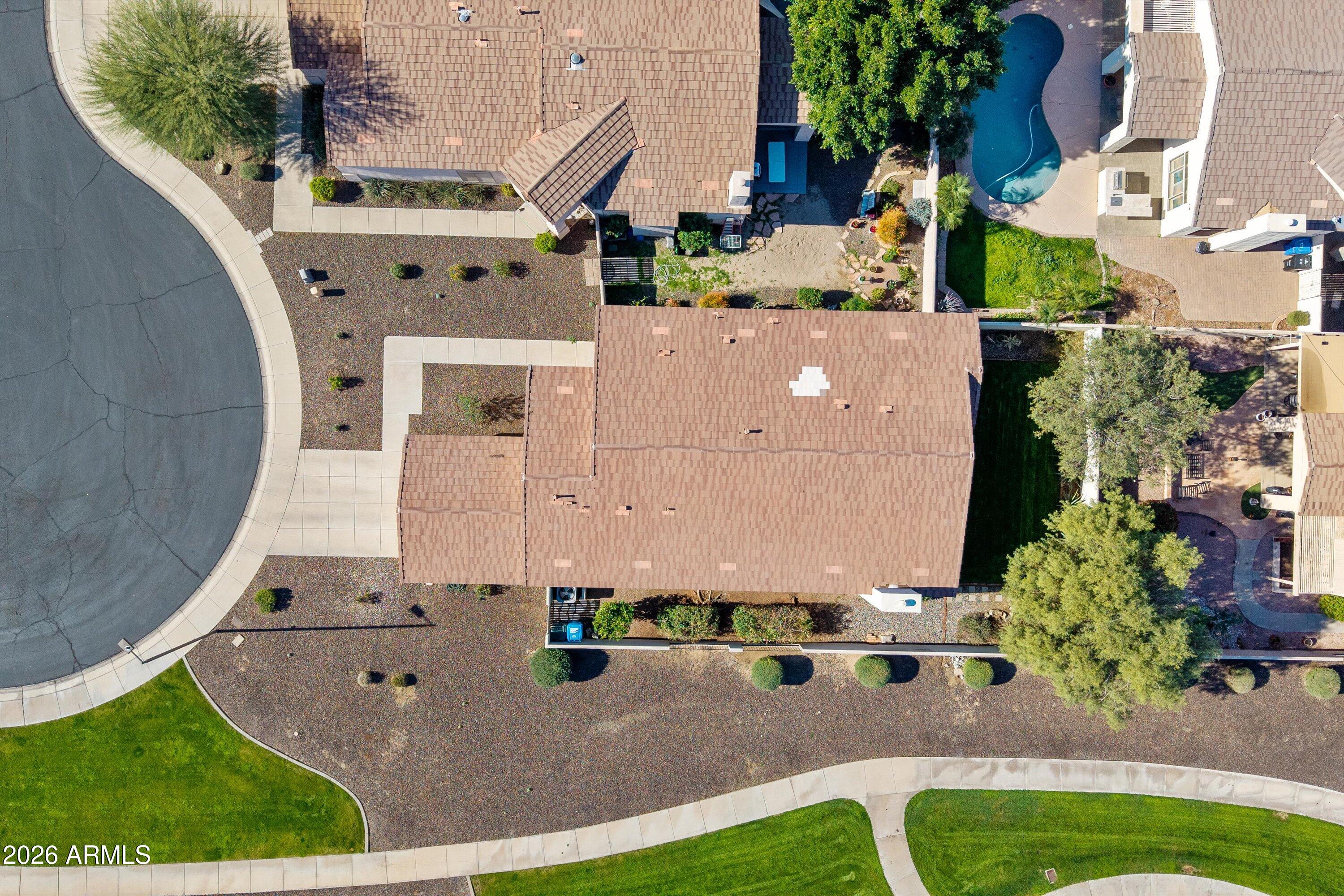 2130 East Beautiful Lane Phoenix, AZ 85042 - Photo 29 of 35 an aerial view of a house with a yard and lake view