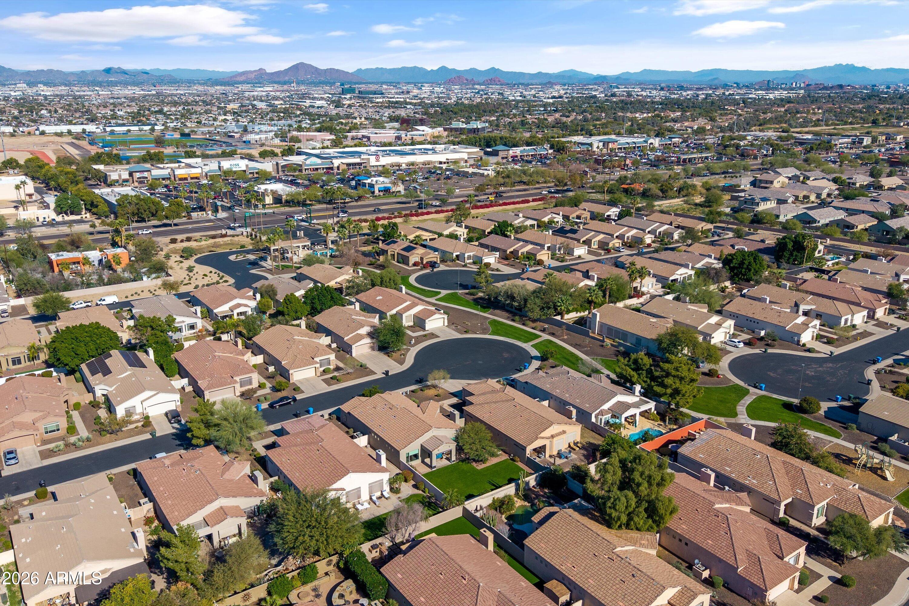 2130 East Beautiful Lane Phoenix, AZ 85042 - Photo 32 of 35 an aerial view of a city with lots of residential buildings