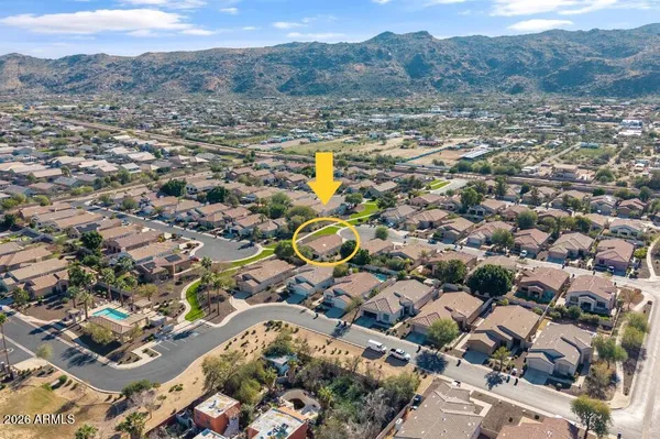 an aerial view of residential houses with outdoor space
