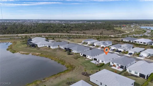 an aerial view of a house with a lake view