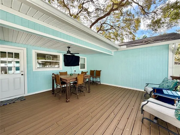 a front view of a house with a yard porch and sitting area