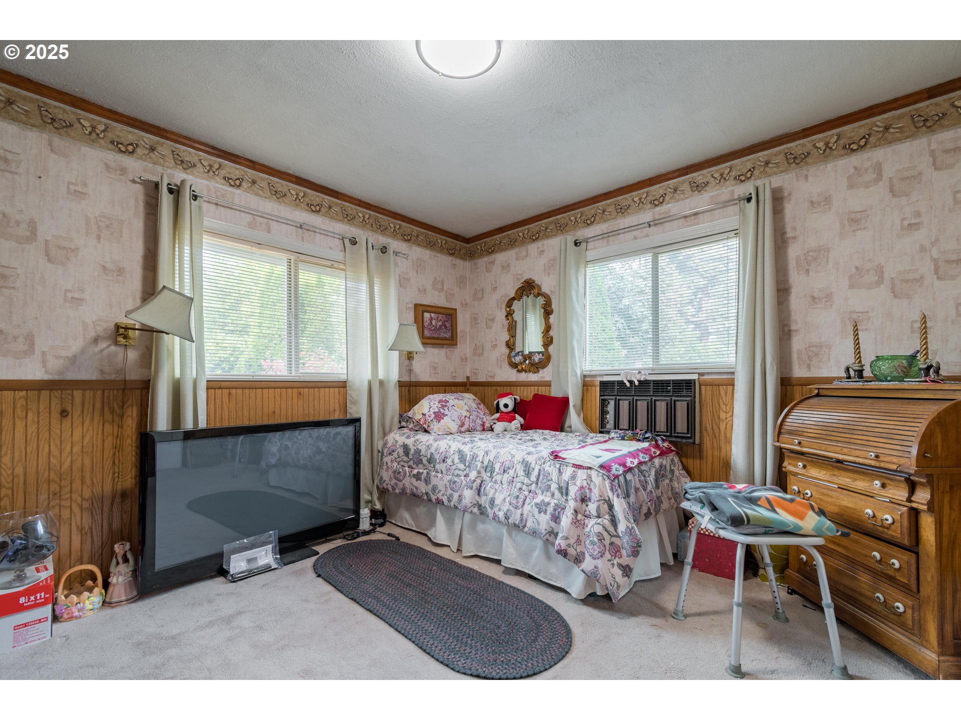 860 Adams Street Eugene, OR 97402 - Photo 18 of 46 a bed room with a bed mirror and a window