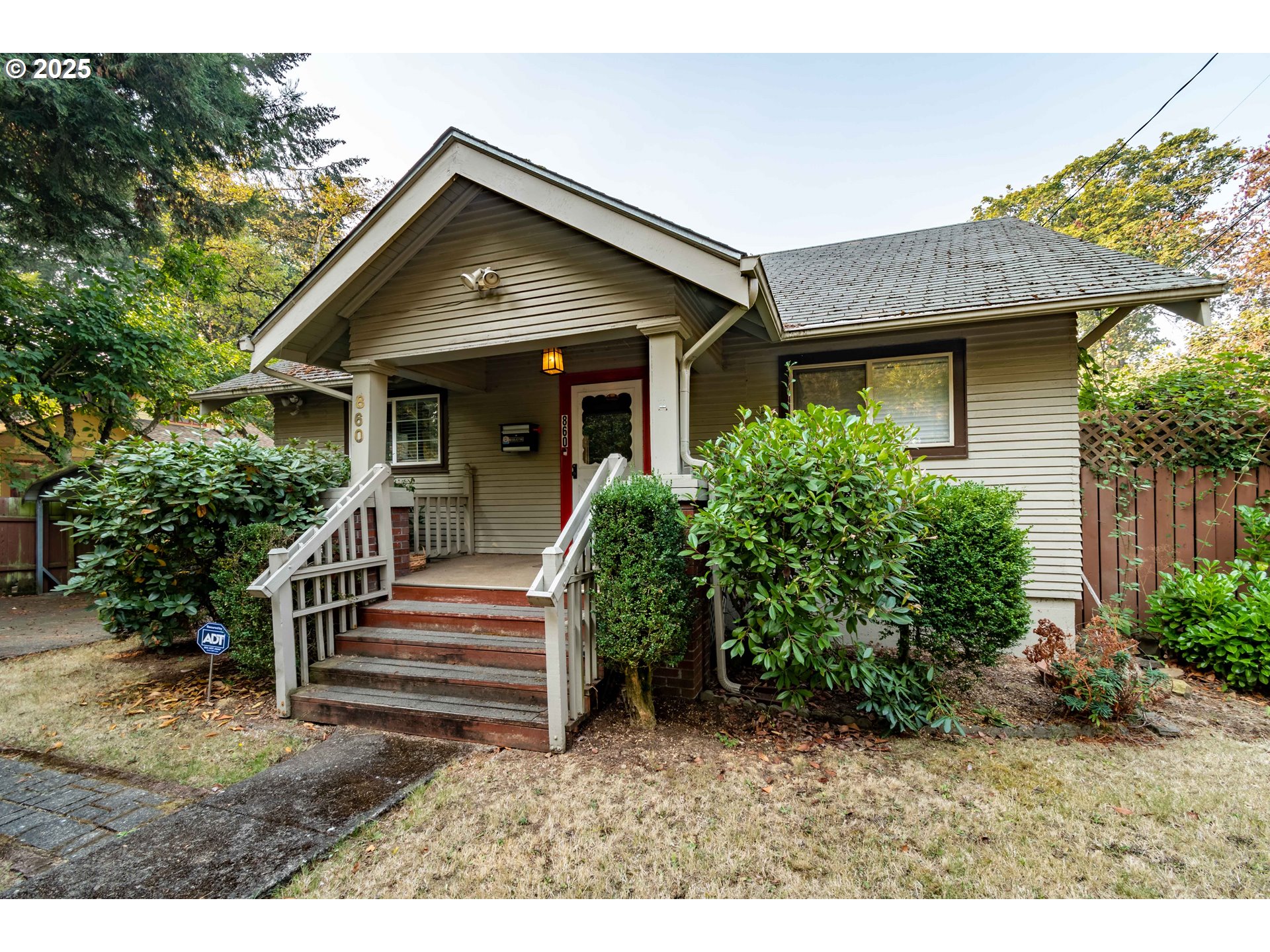 860 Adams Street Eugene, OR 97402 - Photo 2 of 46 a front view of a house with a yard