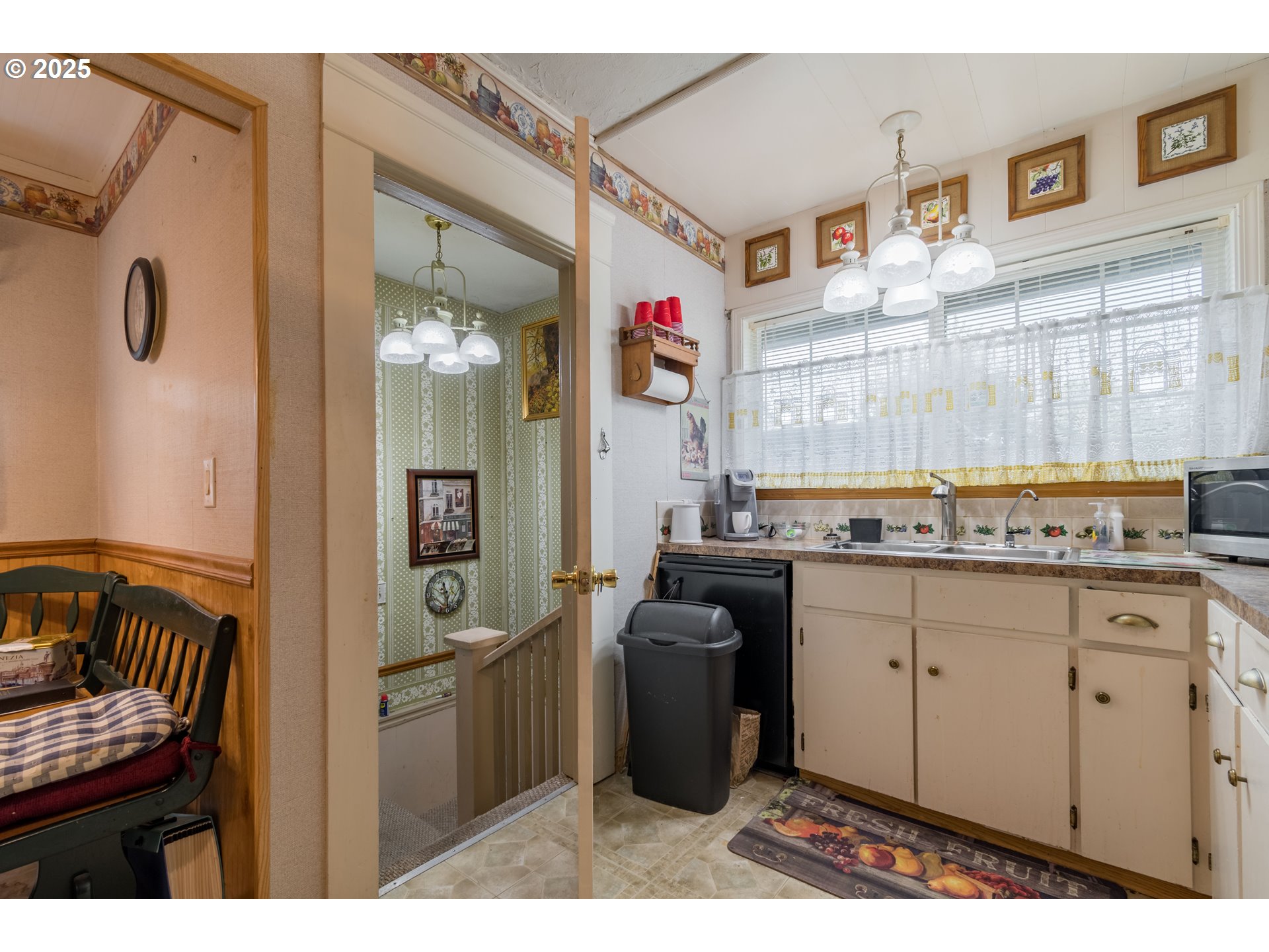 860 Adams Street Eugene, OR 97402 - Photo 23 of 46 a kitchen with granite countertop a sink cabinets and stainless steel appliances