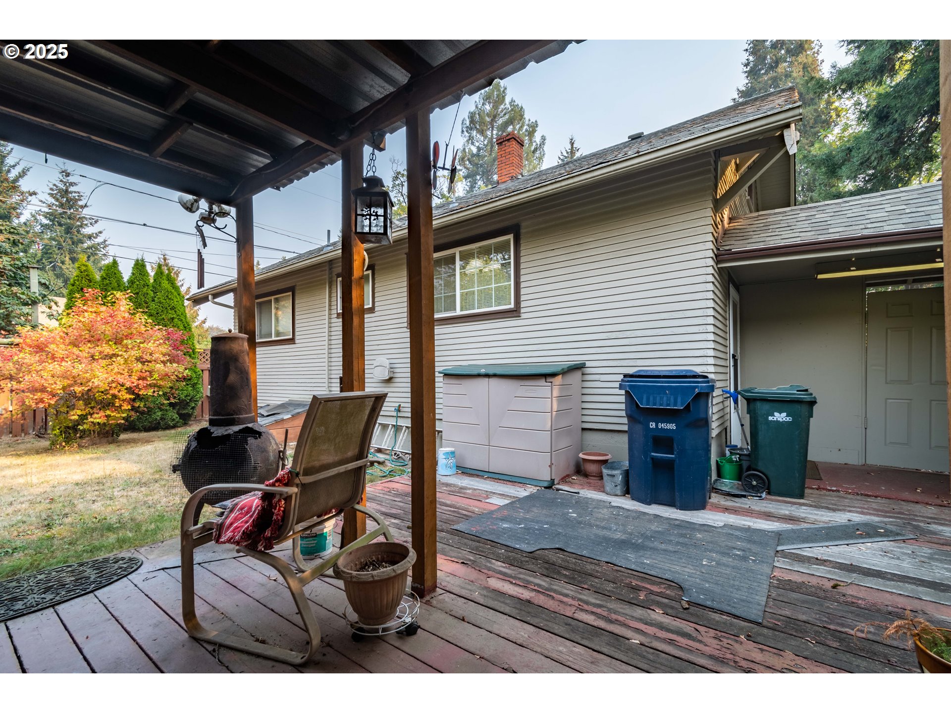 860 Adams Street Eugene, OR 97402 - Photo 35 of 46 a view of a patio with table and chairs with wooden floor and fence