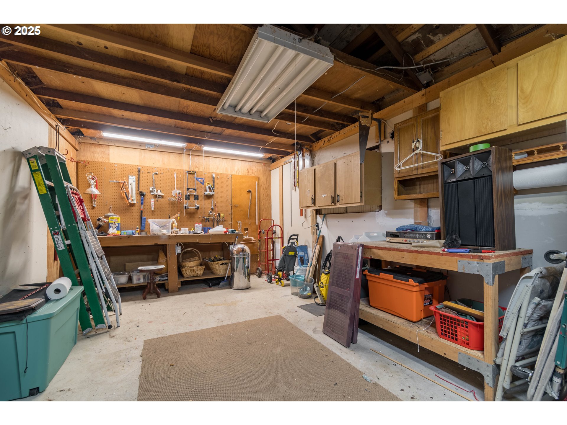 860 Adams Street Eugene, OR 97402 - Photo 39 of 46 a living room with furniture a flat screen tv and a fireplace