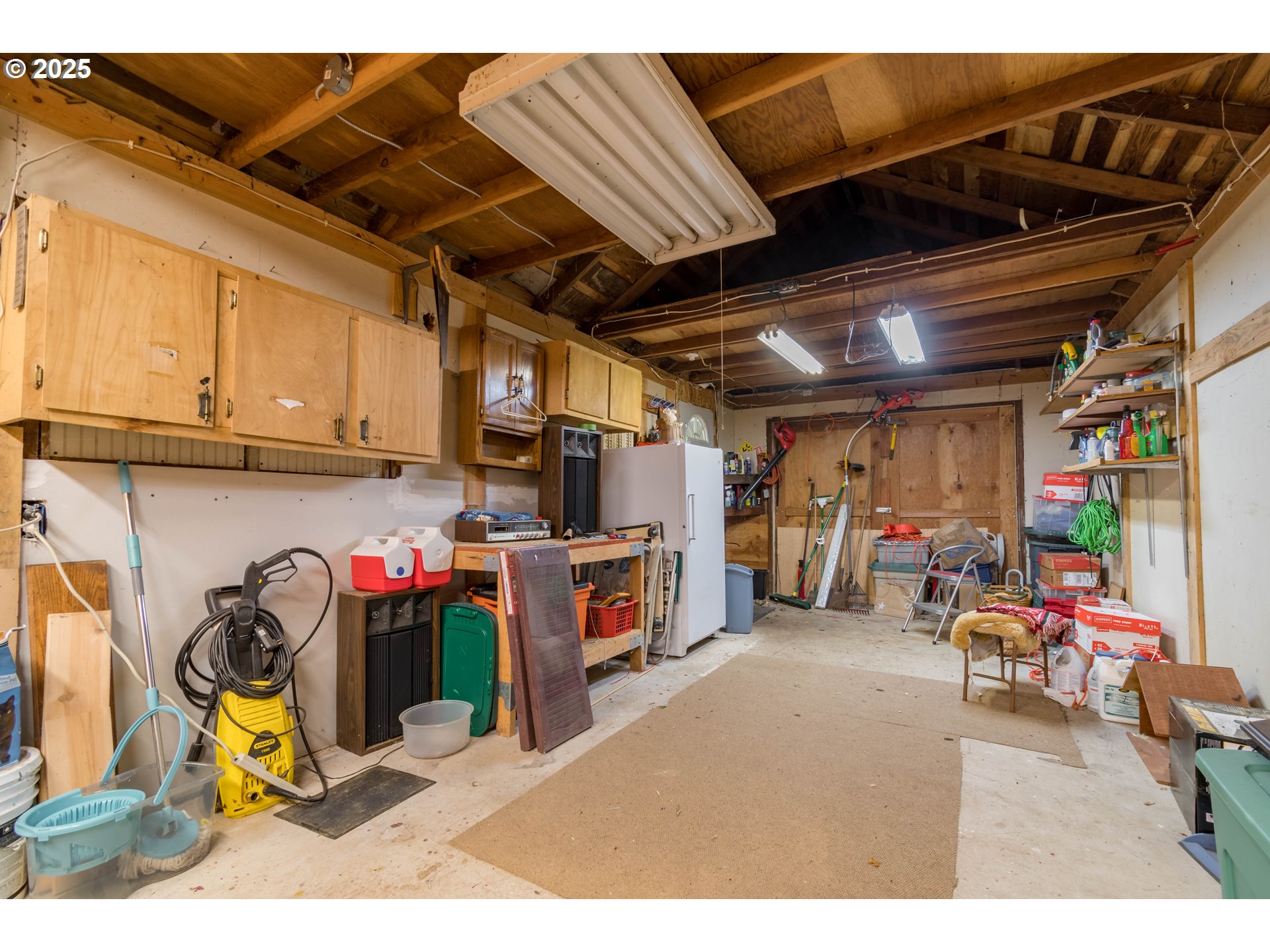 860 Adams Street Eugene, OR 97402 - Photo 40 of 46 a view of a storage room with a lot of stuff