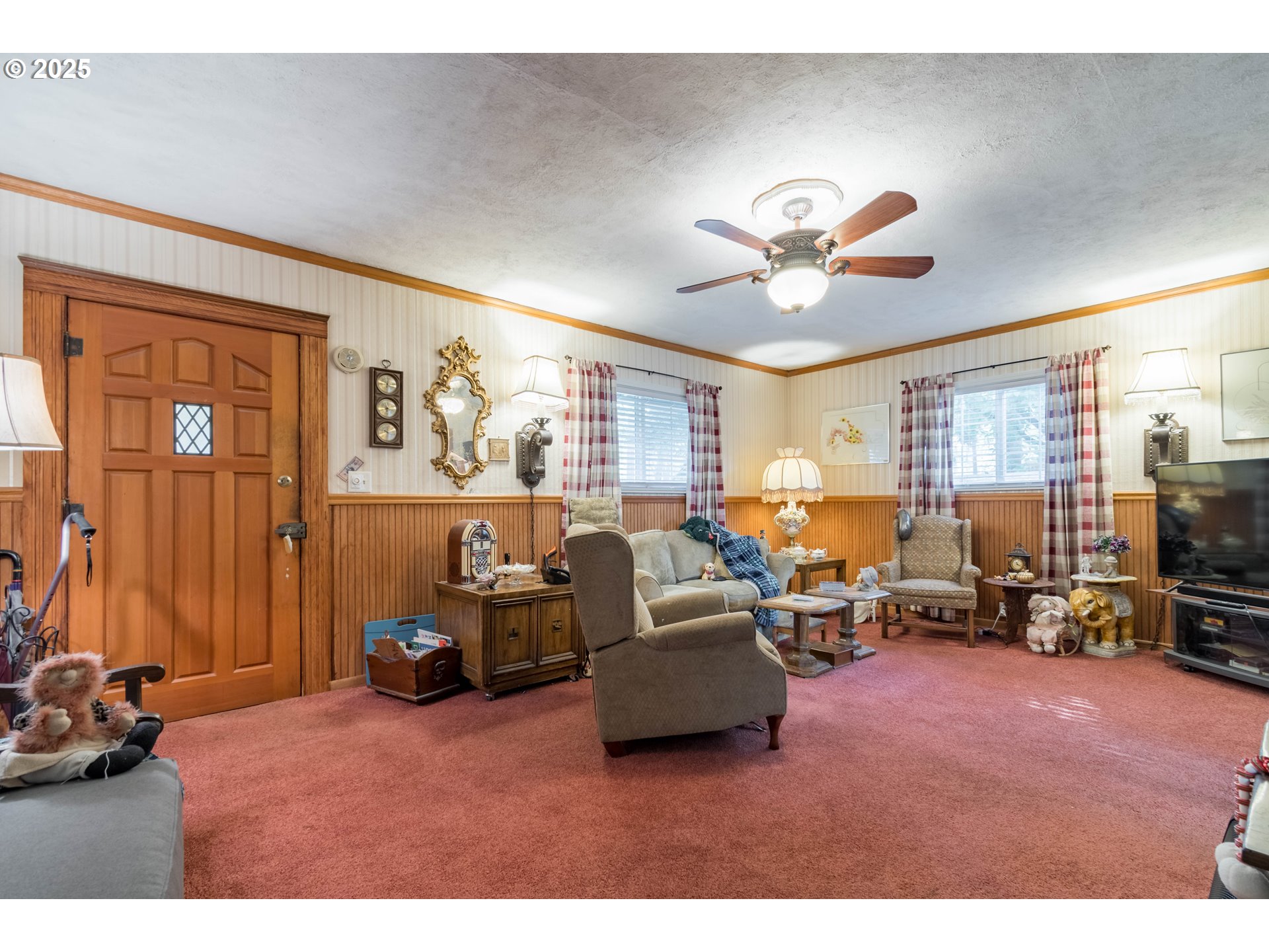 860 Adams Street Eugene, OR 97402 - Photo 4 of 46 a living room with furniture gym equipment and a large window