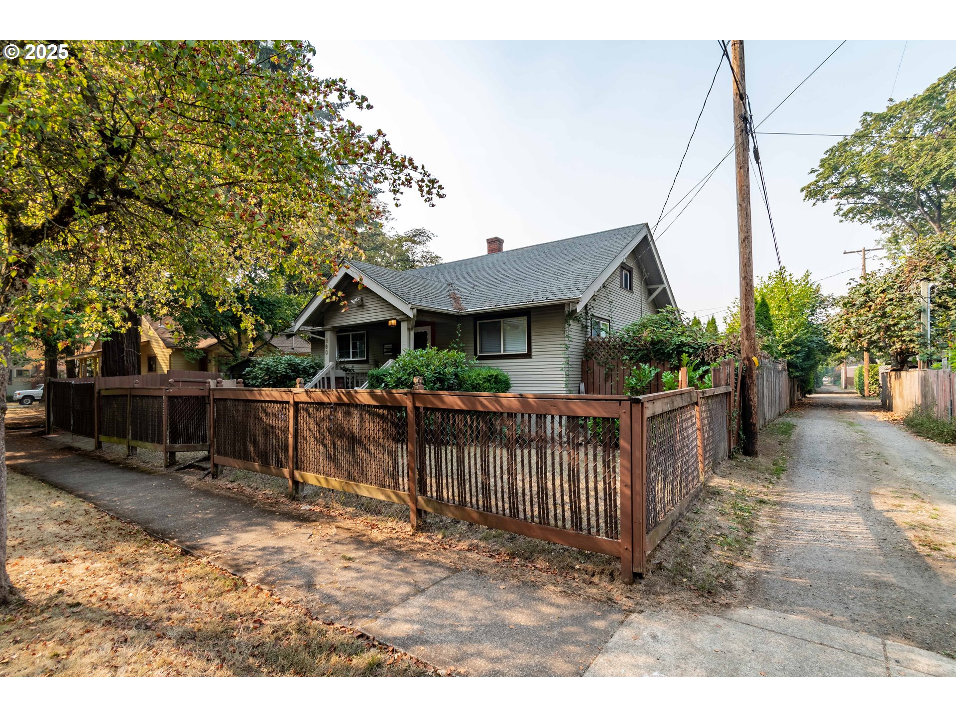 860 Adams Street Eugene, OR 97402 - Photo 43 of 46 a view of house with wooden deck and furniture