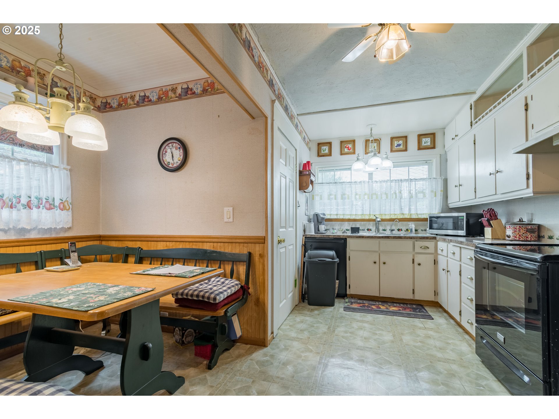 860 Adams Street Eugene, OR 97402 - Photo 7 of 46 a kitchen with a stove and a refrigerator