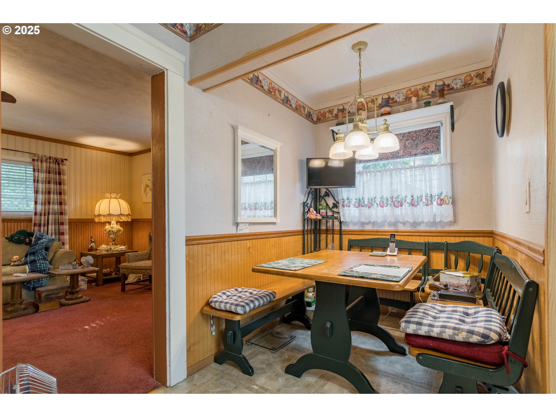 860 Adams Street Eugene, OR 97402 - Photo 8 of 46 a dining room with furniture and a chandelier