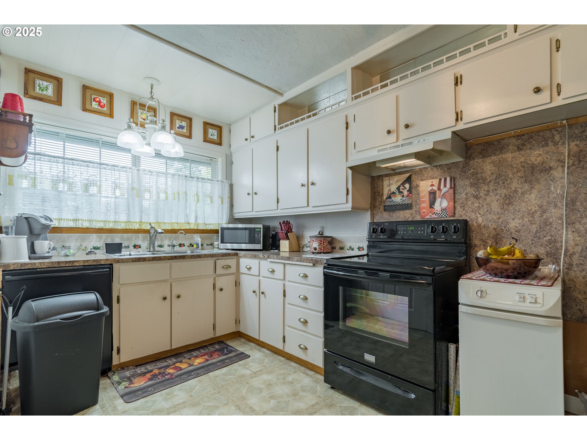 860 Adams Street Eugene, OR 97402 - Photo 9 of 46 a kitchen with granite countertop cabinets stainless steel appliances and a sink