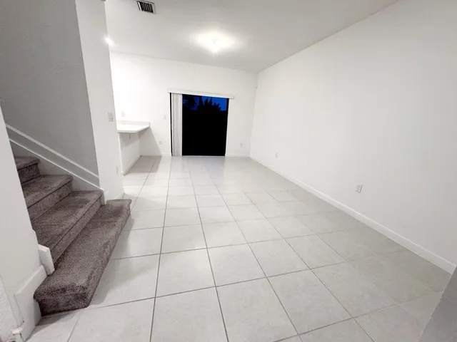 a white toilet sitting next to a bath tub
