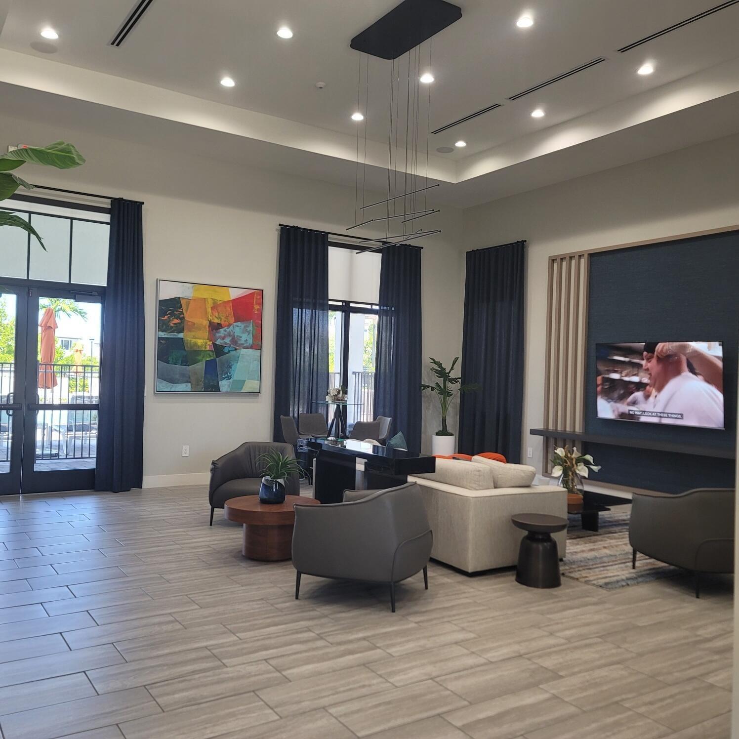 28706 Southwest 133rd Court Homestead, FL 33033 - Photo 34 of 40 a living room with furniture and a flat screen tv