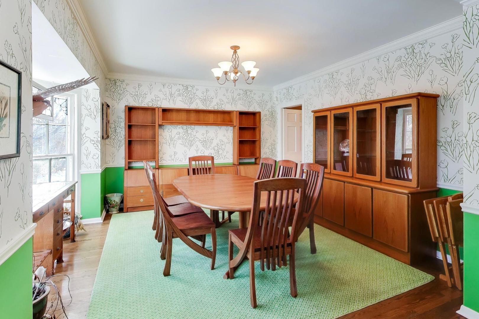 600 Riverwoods Road Mettawa, IL 60045 - Photo 14 of 49 a dining room with furniture a rug a potted plant and a chandelier