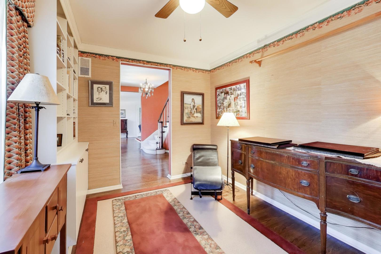 600 Riverwoods Road Mettawa, IL 60045 - Photo 16 of 49 a living room with furniture and a flat screen tv