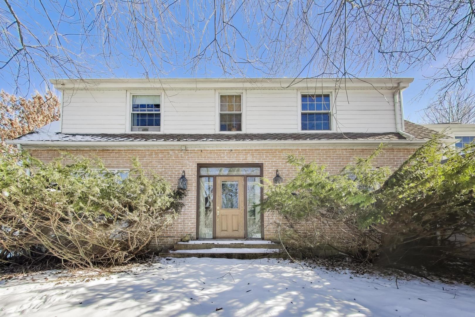 600 Riverwoods Road Mettawa, IL 60045 - Photo 2 of 49 a front view of a house with a yard