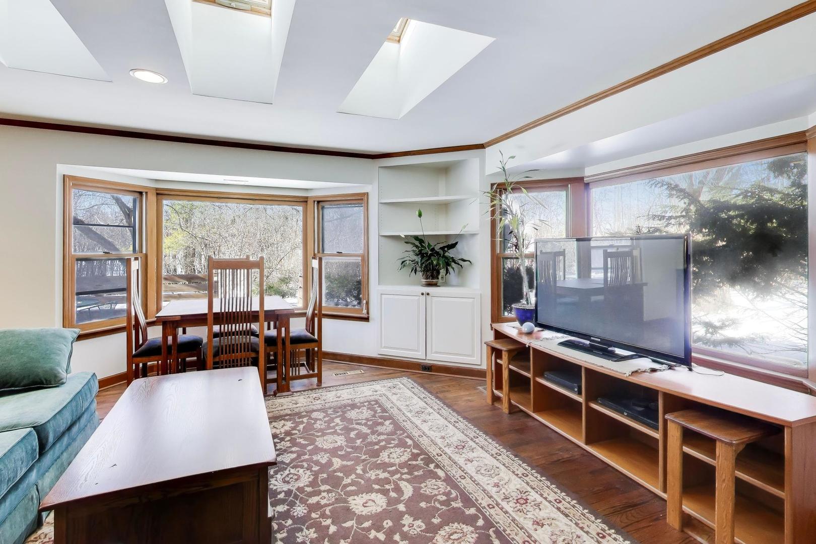 600 Riverwoods Road Mettawa, IL 60045 - Photo 22 of 49 a living room with furniture a rug and a large window