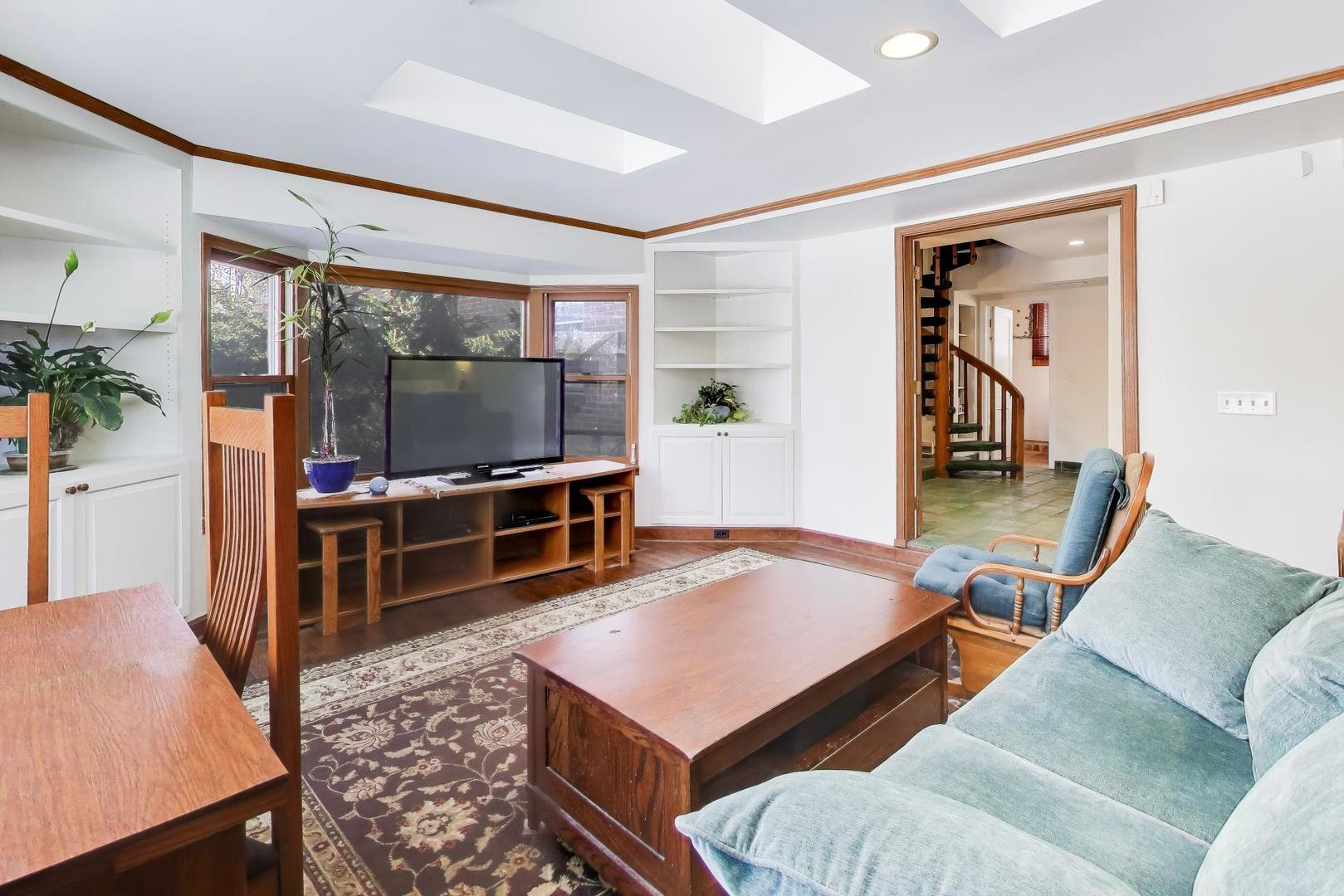 600 Riverwoods Road Mettawa, IL 60045 - Photo 23 of 49 a living room with furniture and a flat screen tv