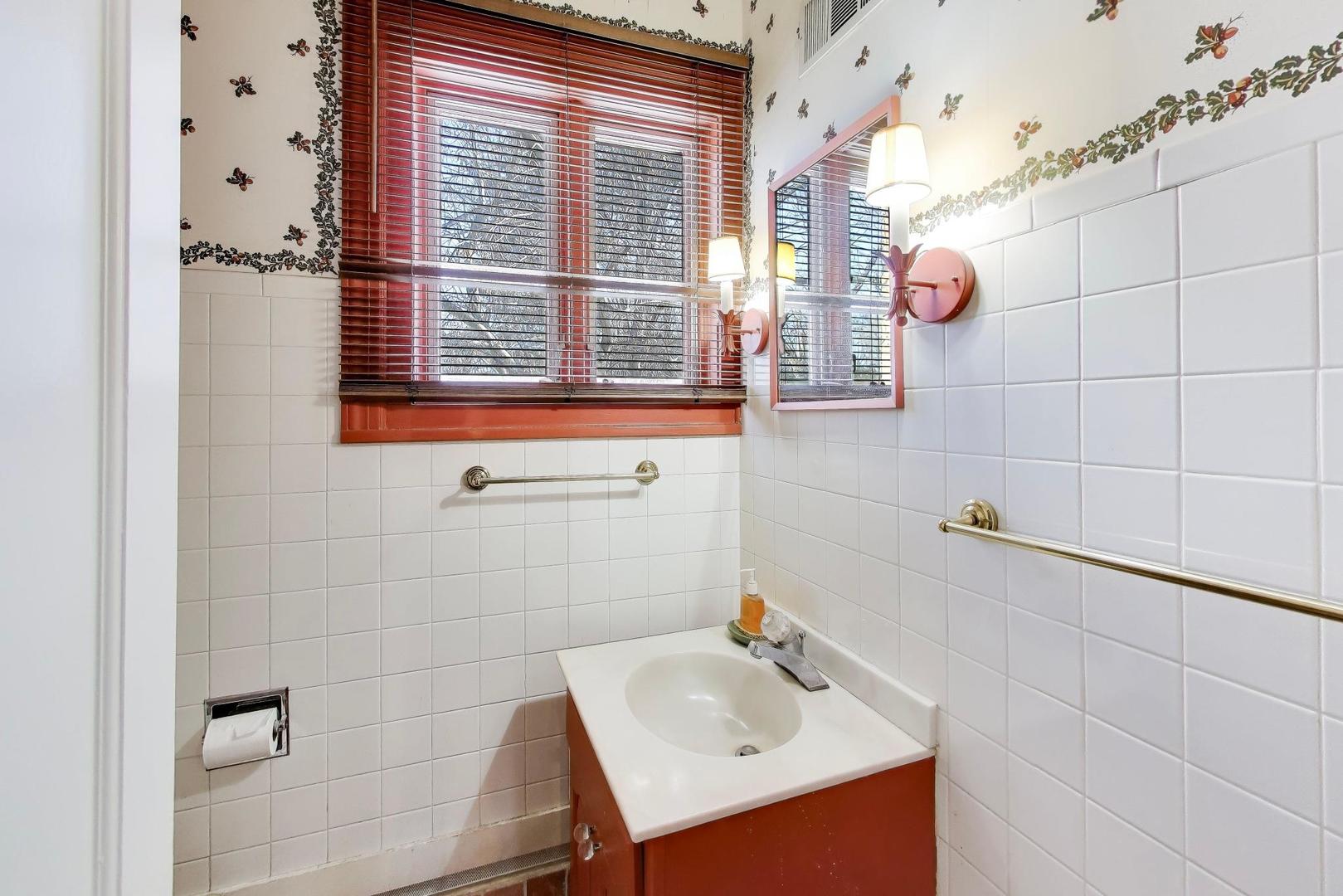 600 Riverwoods Road Mettawa, IL 60045 - Photo 26 of 49 a bathroom with a sink a window and shower