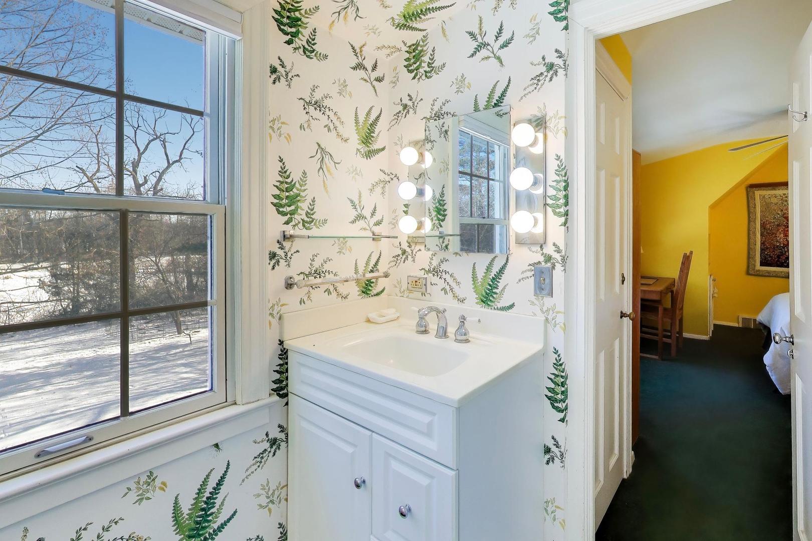 600 Riverwoods Road Mettawa, IL 60045 - Photo 32 of 49 a bathroom with a sink and a mirror
