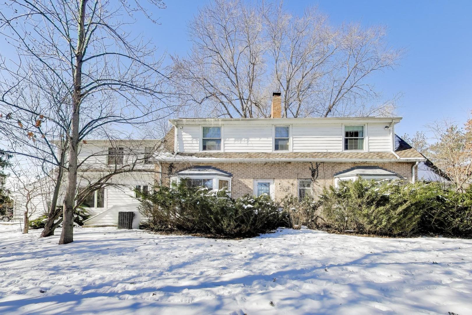 600 Riverwoods Road Mettawa, IL 60045 - Photo 41 of 49 a front view of a house with a yard