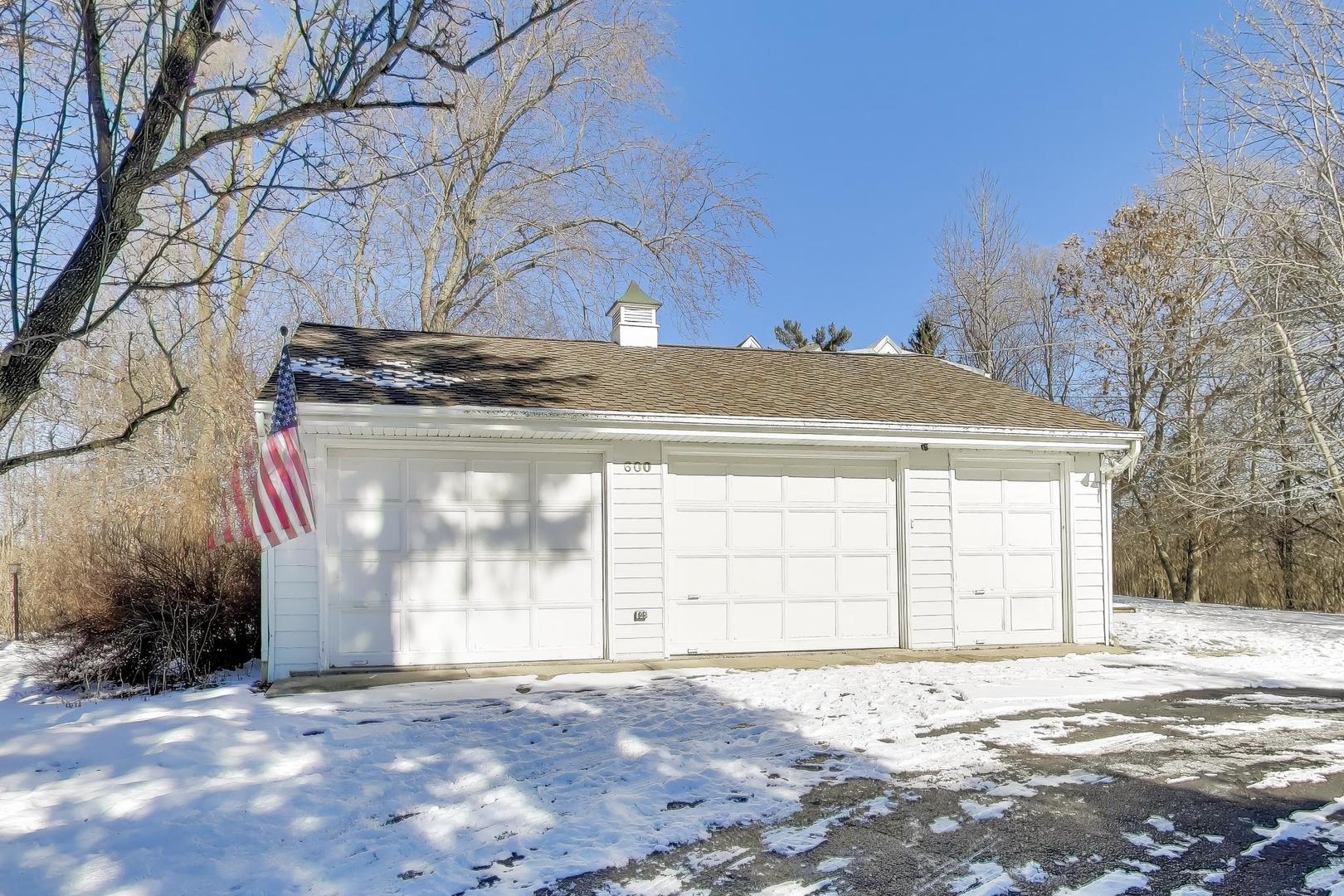 600 Riverwoods Road Mettawa, IL 60045 - Photo 42 of 49 a view of a house with a yard