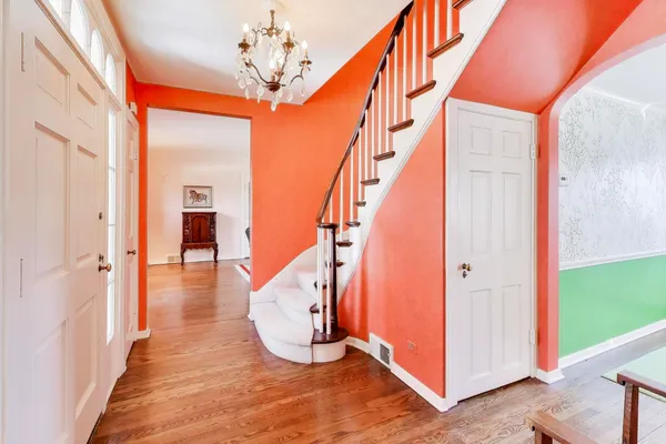 a view of entryway with wooden floor