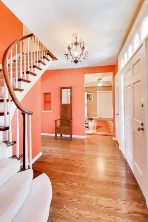 a view of an entryway with wooden floor