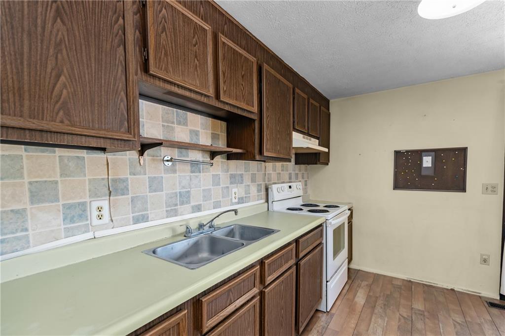 300 Moon Ridge Drive Freedom, PA 15042 - Photo 13 of 32 a kitchen that has a sink and a stove